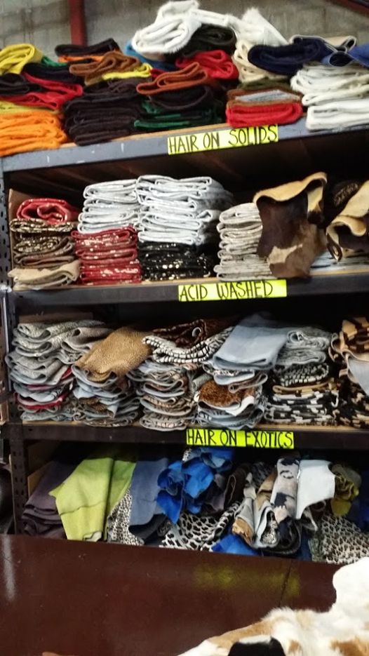 Shelves of folded cowhides in the warehouse